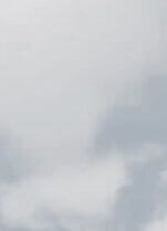 Low-angle view of modern skyscrapers against cloudy sky – Neutrinos