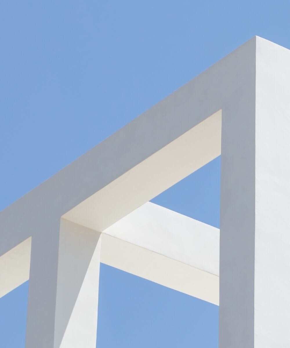 White minimalist architectural frame against blue background – Neutrinos