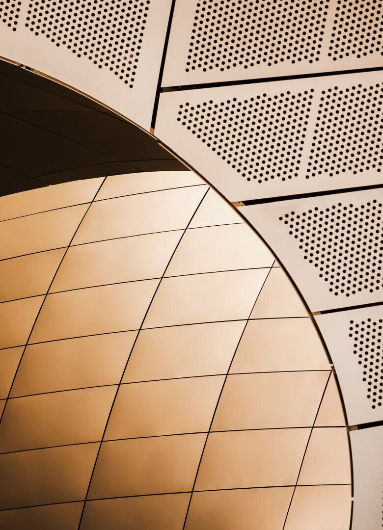 Futuristic architectural design featuring gold curved panels and dotted textures – Neutrinos