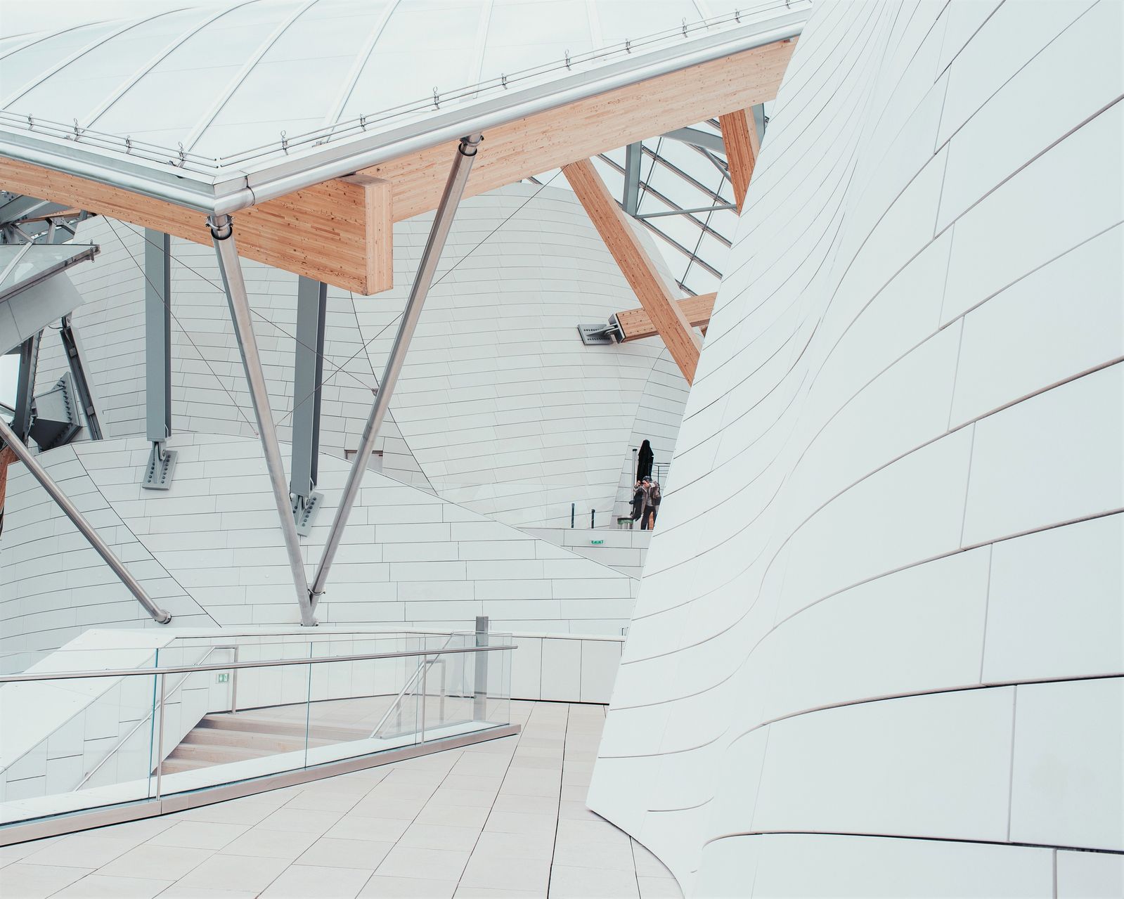 A white business center with beautiful textures and a unique design with interior staircases