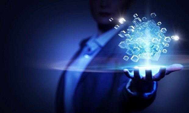 Businessperson holding a glowing 3D digital cube network representing innovation and technology - Neutrinos